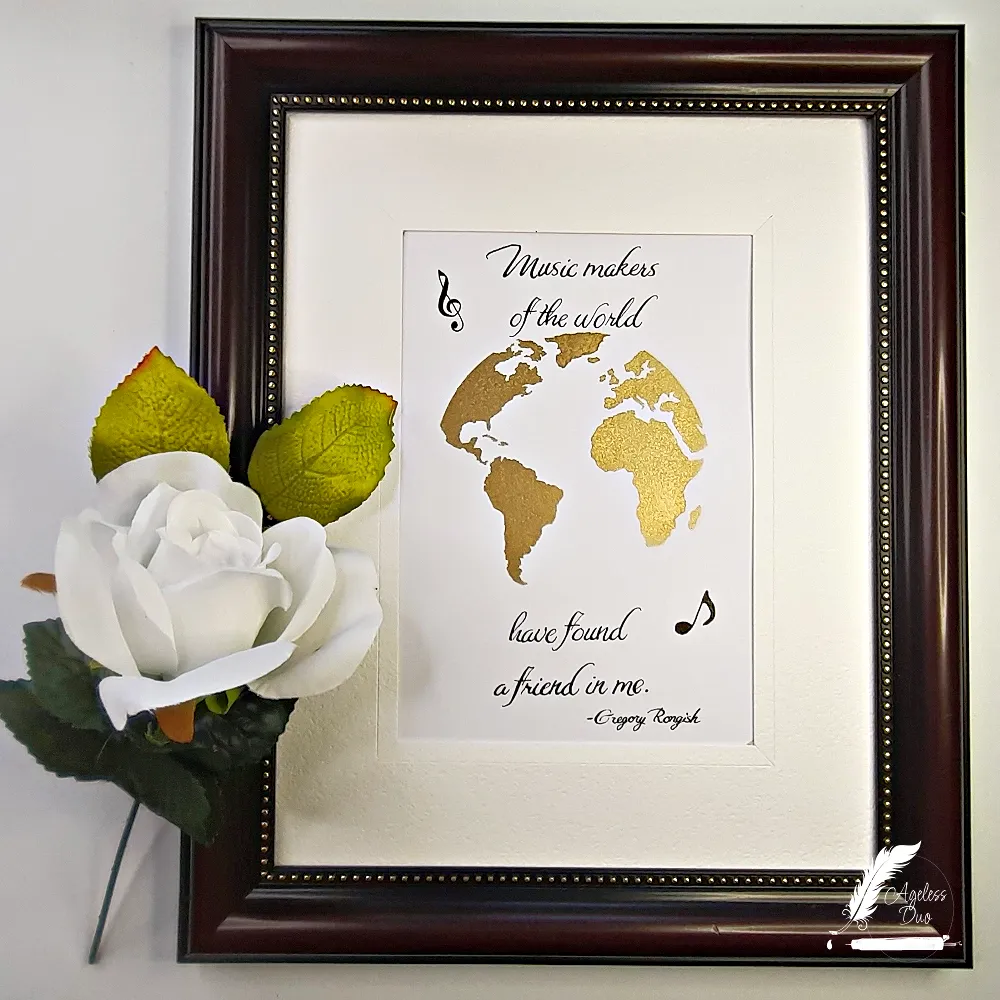 Luxury hand-calligraphed wall art featuring the quote “Music makers of the world have found a friend in me” with gold metallic airbrushing