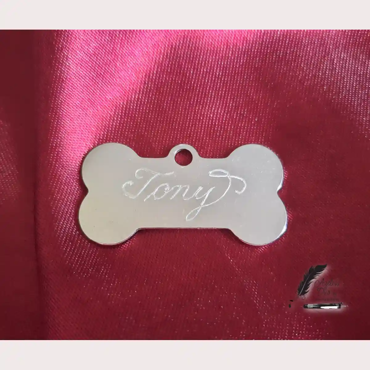 Bone-shaped dog tag engraved with the name Tony