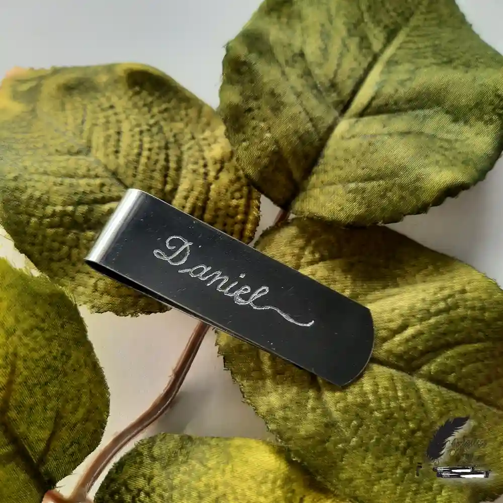 Stainless steel money clip personalized with the name Daniel through hand engraving