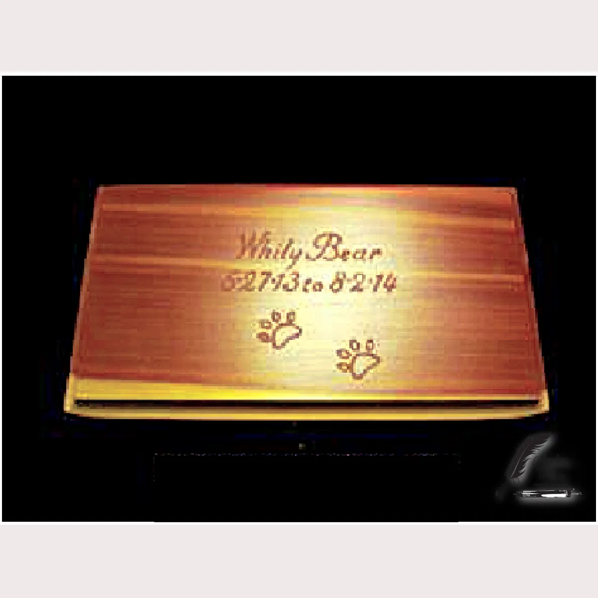 Cedarwood pet urn engraved with a pet name and dates