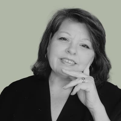 Jeanita, owner of Ageless Duo, master engraver, and professional calligrapher