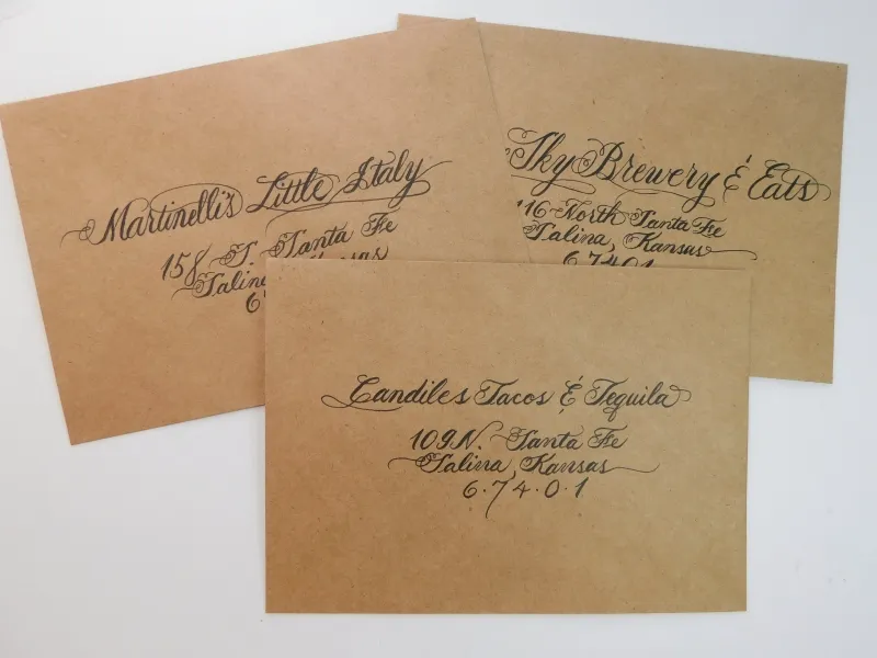 Back of envelope featuring hand-calligraphed return address Kraft envelopes addressed in traditional Copperplate calligraphy