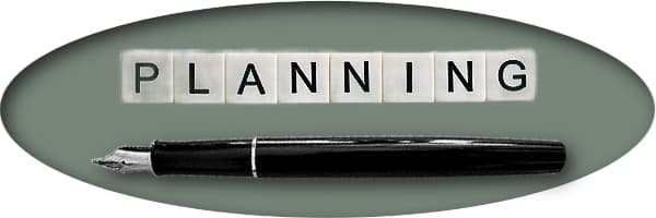 Image reflecting a fountain pen with the word PLANNING over it.